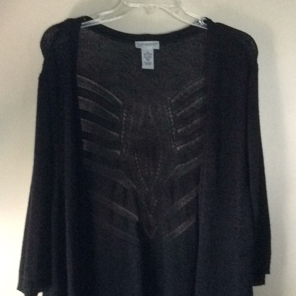 Beautiful black sweater. Back design is cut out